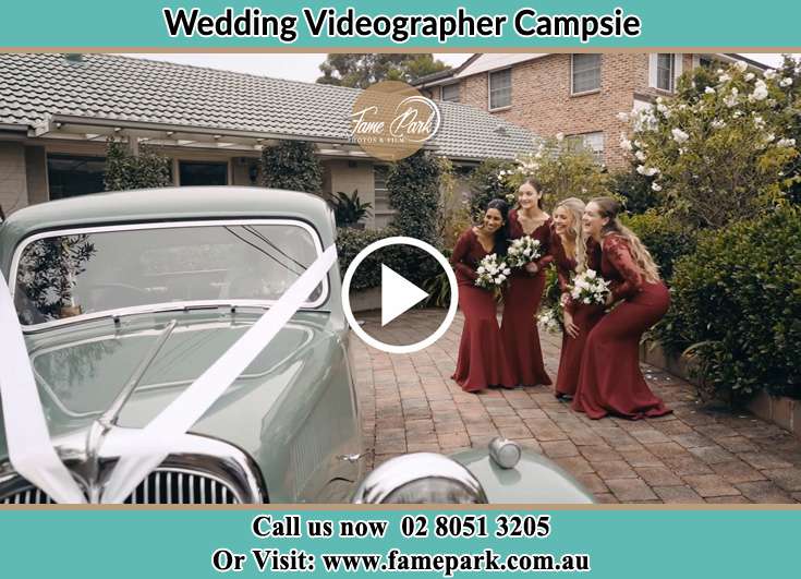 Bride's secondary sponsors looking at the bridal car Campsie NSW 2194