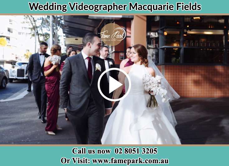 Bride and Groom looking at each other while walking Macquarie Fields NSW 2564