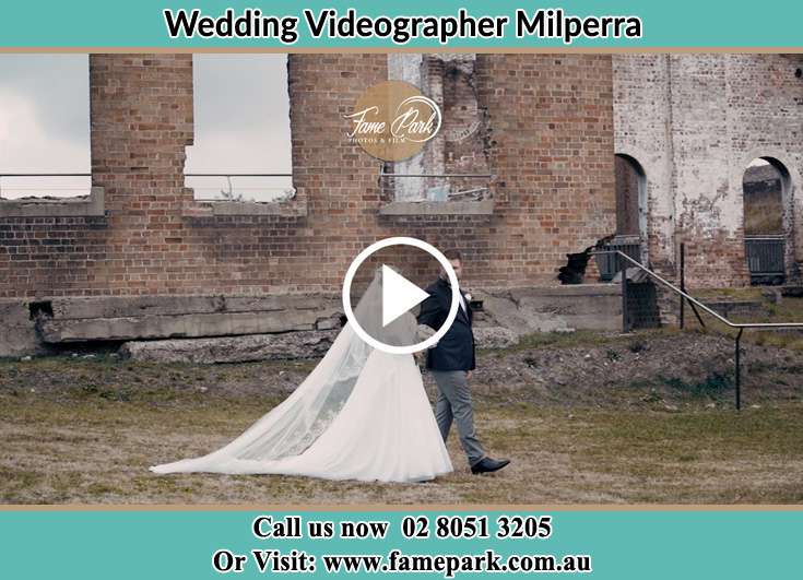 Bride and Groom walking at the ruins Milperra NSW 2214